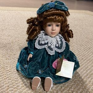 Elegant Teal Porcelain Doll with Lace Collar